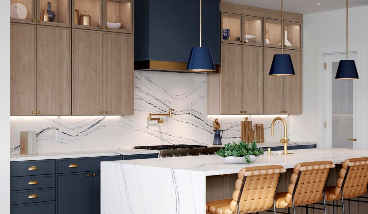 Stunning waterfall island with classic navy blue hood and matching pendants with swan oak contemporary cabinetry.