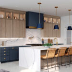 Stunning waterfall island with classic navy blue hood and matching pendants with swan oak contemporary cabinetry.