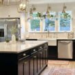 Whole home remodel included expansion of kitchen and living room areas, remodeled an upstairs office into a primary bathroom, and remodeled a storage room in basement into a lounge nook. Amazing Results!